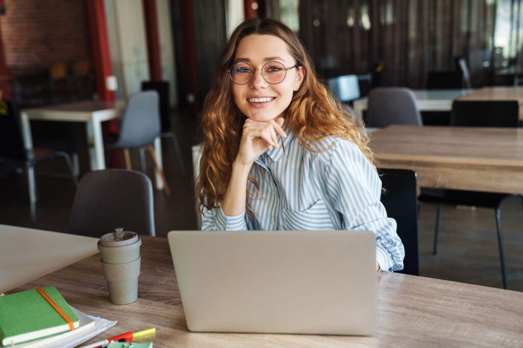 Smiling professional woman working on a laptop